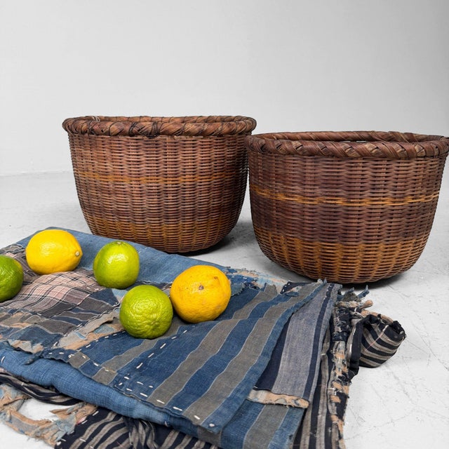 Decorative set of two vintage Japanese bamboo baskets, most likely dating from the 1960s–1970s. Dimensions large basket:...
