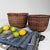 Decorative set of two vintage Japanese bamboo baskets, most likely dating from the 1960s–1970s. Dimensions large basket:...