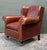 This exquisite leather wingback club chair and matching ottoman set, crafted by Milling Road for Baker Furniture,...