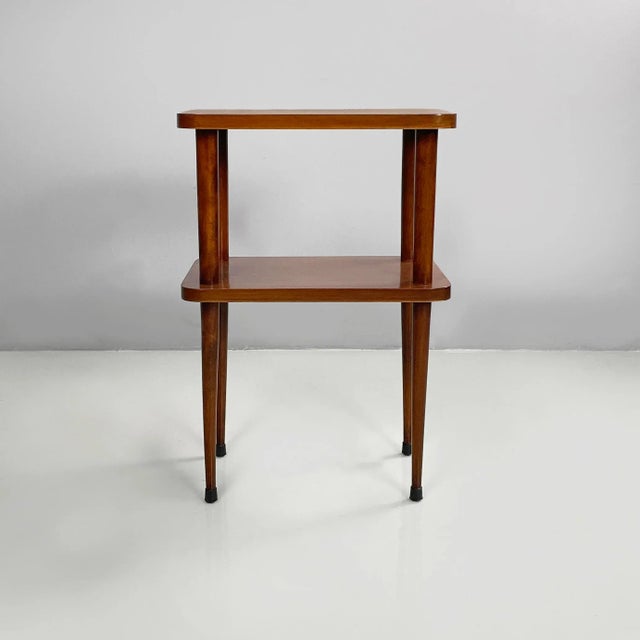 Italian mid-century modern double shelf coffee table in wood, 1950s Coffee table with two rectangular shelves with rounded...