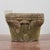 This stone capital, consolidated with cement, is an antique piece bearing the signs of time and the elements. Its surface,...