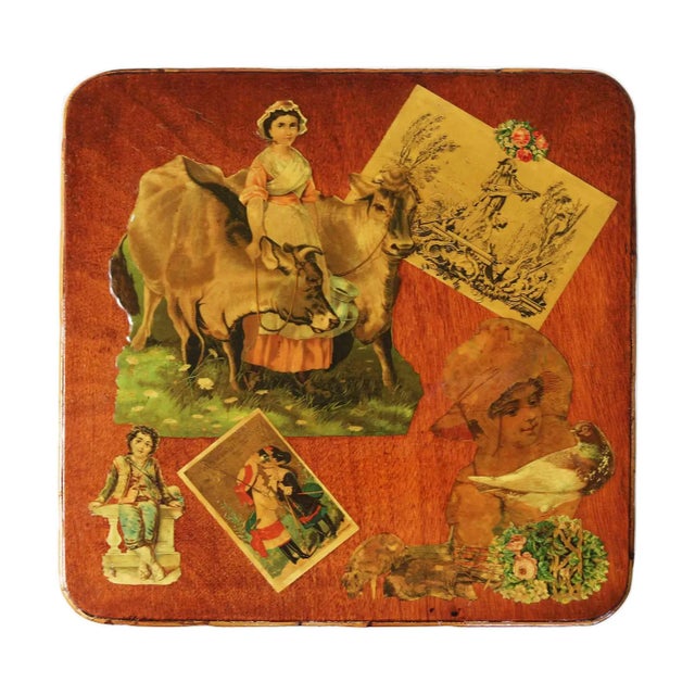 Vintage bamboo side table with decoupage top. Constructed with cross-stretchers for stability.