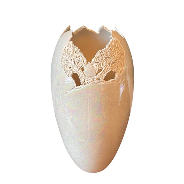 A substantial signed studio ceramic vessel featuring a sculptural fractured rim and applied high-relief tree motif. The...