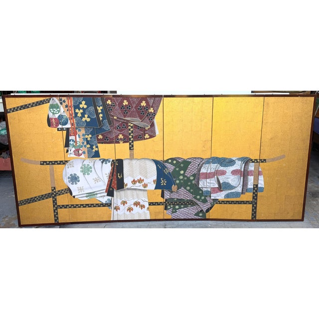 Mid-Century Japanese Six-Panel Byōbu/Screen Depicting Kimonos and Obi Draped on an Ikō Rack A beautifully composed...