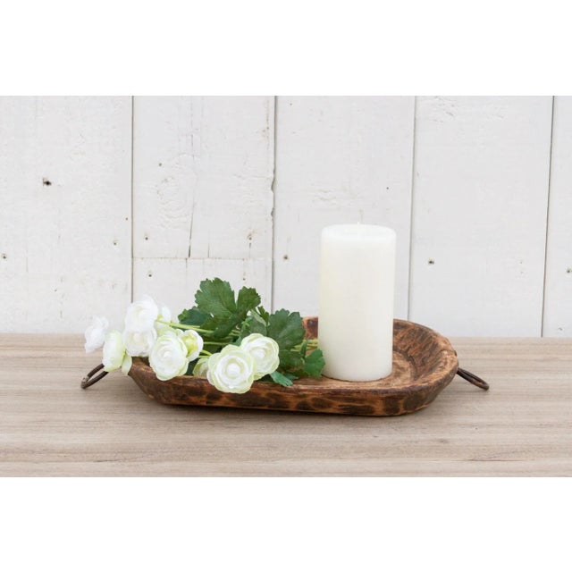 An old oval shape wood bowl originally used for kneading dough. Found in the Swat Valley. This antique dough bowl was made...
