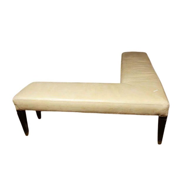 Jansen style L shaped bench with cream leather embossed on sides with Greek key and medallion designs. Bench is finished...