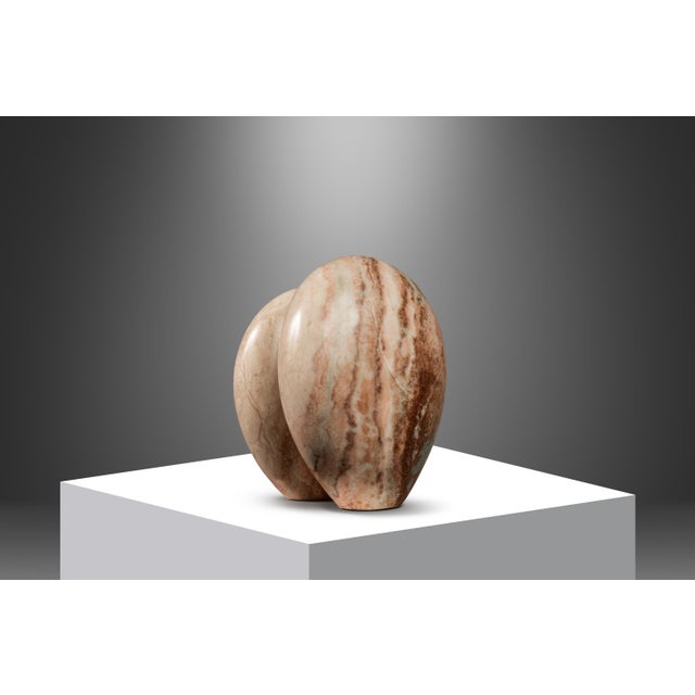 Hand-sculpted in pure, solid Colorado Pink Alabaster this fascinating "Void Leading to Breath" sculpture is absolutely...