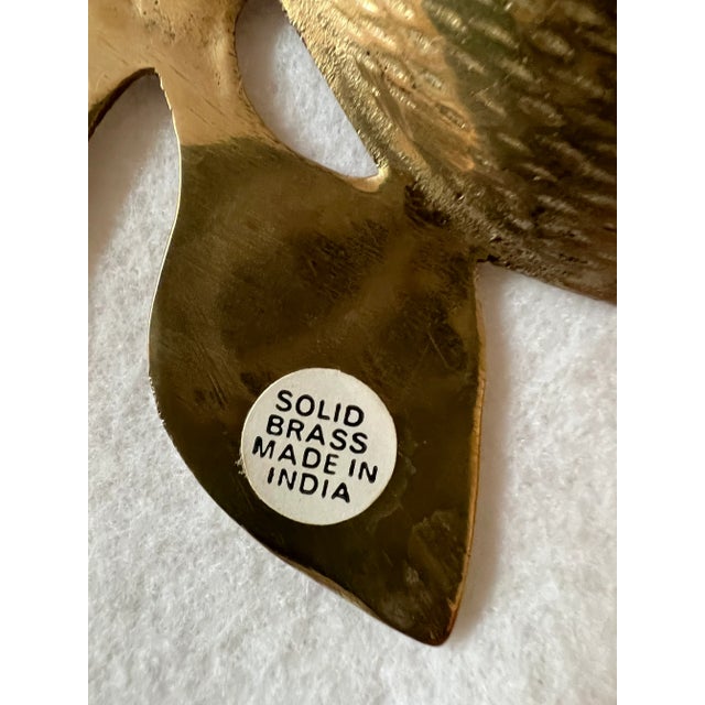 Vintage brass, made in India, coin, jewelry or trinket dish in the shape of an apple with a detailed stem. The underside...