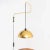 Italian wall lamp made of brass with pivot arm and black cable hanging down lampshade (ø40 cm). The switch functions as a...