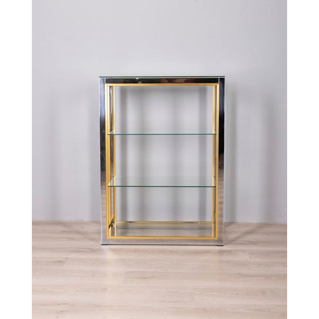 Small shelf with chromed and gold metal frame, clear glass shelves, designed by Renato Zevi, 1970s. I have official proof...