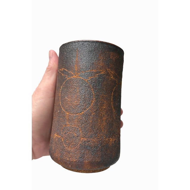 A charming vintage mid-century modern studio pottery piece crafted in warm, iron-flecked stoneware. Hand-thrown with an...