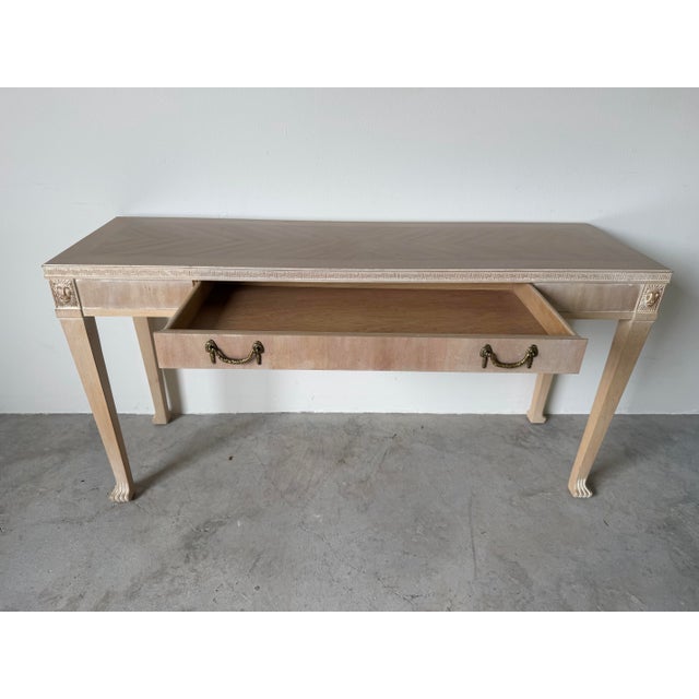Elegant vintage Italian Neoclassical style console table featuring a beautifully carved Greek Key border and distinctive...