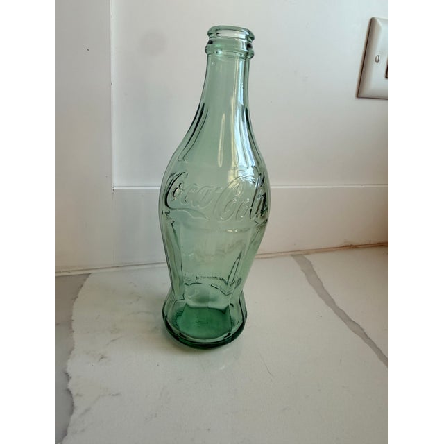 Gotta love that hobbleskirt! Just a touch hippier than a regular bottle. Add a touch of iconic Americana and corporate...