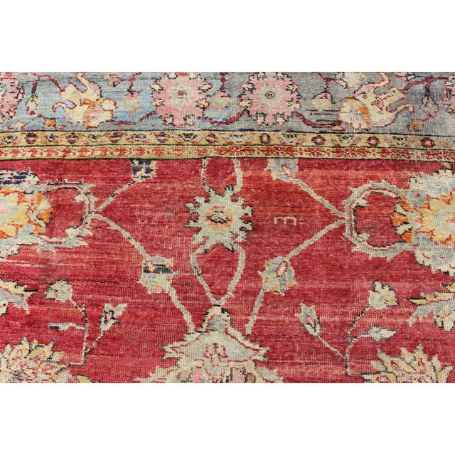 Red Early 20th Century Antique Turkish Oushak Rug in Red Blue/Gray Border L. Green Yellow & Pink For Sale - Image 8 of 11