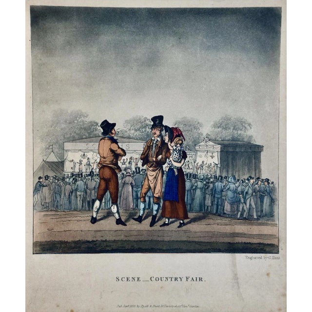 This is a framed colored engraving entitled "Scene _ Country Fair" by George Hunt, published in London in 1825. It depicts...