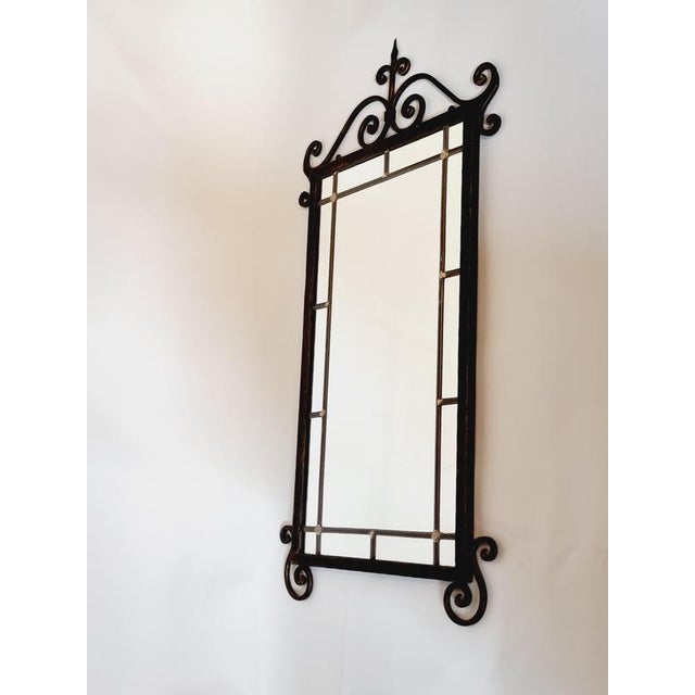 Cast iron wall mirror with beautiful, decorative ornaments. A timeless piece that works in most rooms and interiors....