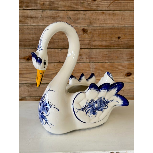 A striking hand-painted ceramic swan planter crafted in Portugal, marked RC CL and signed “Made in Portugal – Hand...