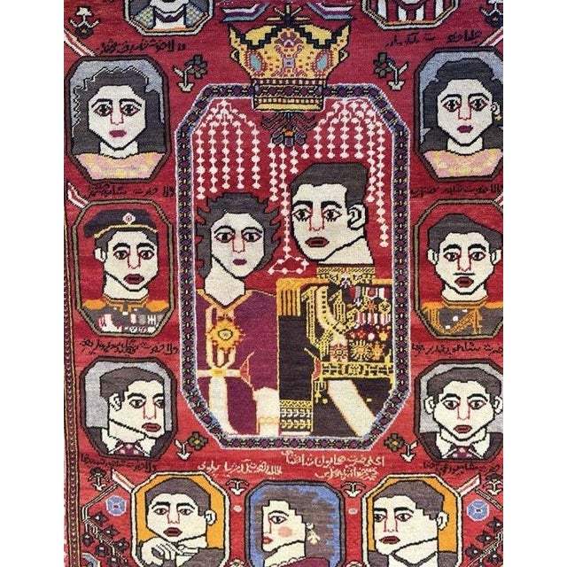 A striking mid-20th century pictorial rug featuring a richly detailed depiction of a royal family, rendered in a bold and...
