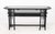Umberto Asnago for Giorgetti "Galaxy" Console Table, 1980s, black lacquered wood and glass. 34.75" H x 72" W x 17" D....