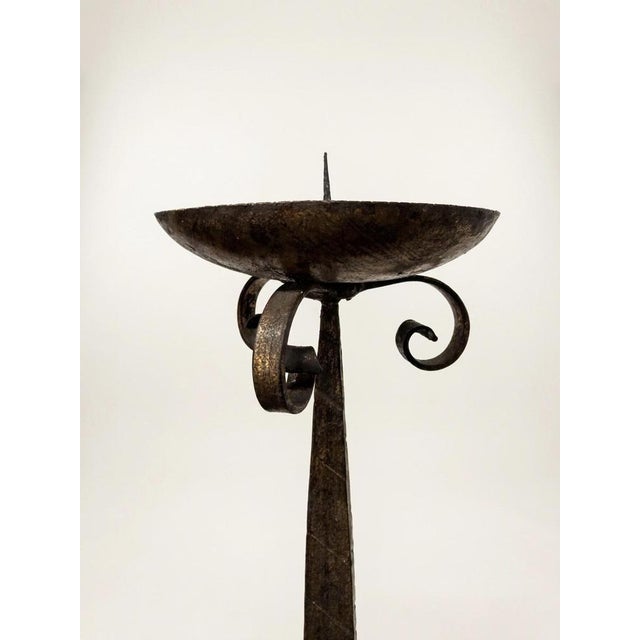 Unearth a powerful statement of historic design with this commanding pair of early 20th-century French candle holders....