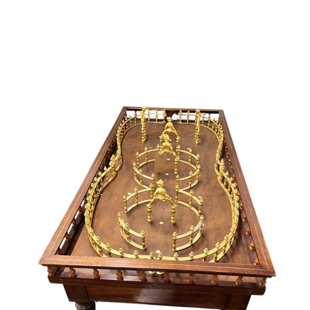 A rare circa 1900 English tabletop skittles table, retaining its original skittle pins and metalwork. Tabletop skittles...