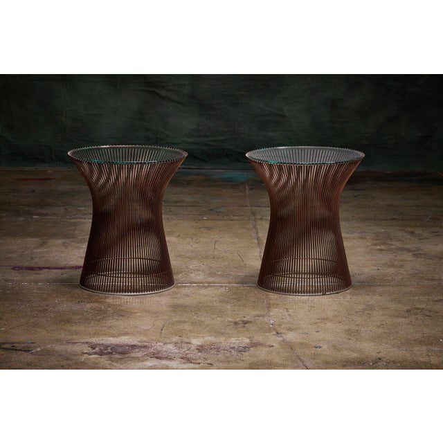 Pair of Warren Platner side tables with rare copper wire-rod bases and glass tops. - Produced by Knoll, USA. - The bases...