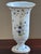 Graceful and refined, this vintage porcelain trumpet vase features delicate blue bellflowers and trailing botanical vines...
