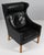 Børge Mogensen wingback chair in original Black leather upholstery. Legs in oak. Model 2204, made by Fredericia Furniture....