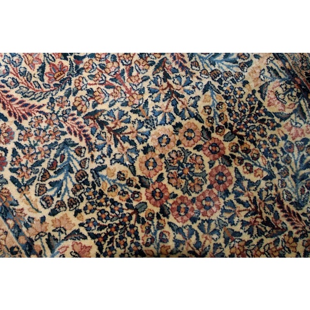 Hand made antique Kerman rug in original good condition from the beginning of 20th century. The rug in in beige shade and...