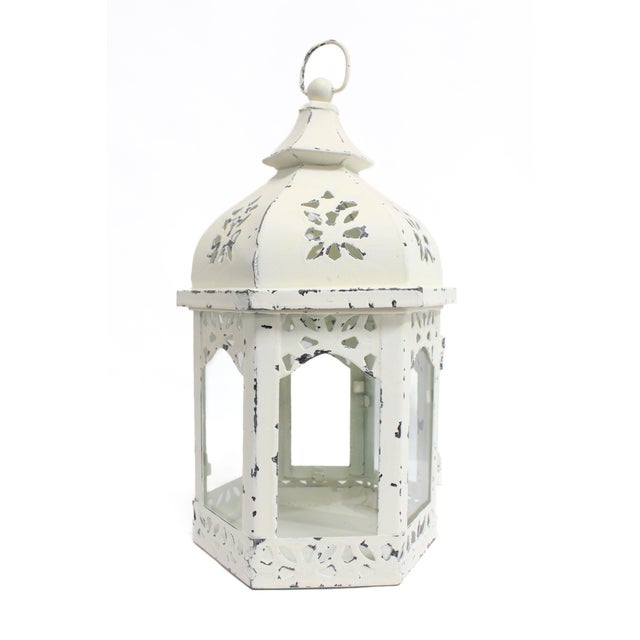 This detailed, hexagon-shaped, lantern can add interest to any area. Open glass door to add candle or any other small...