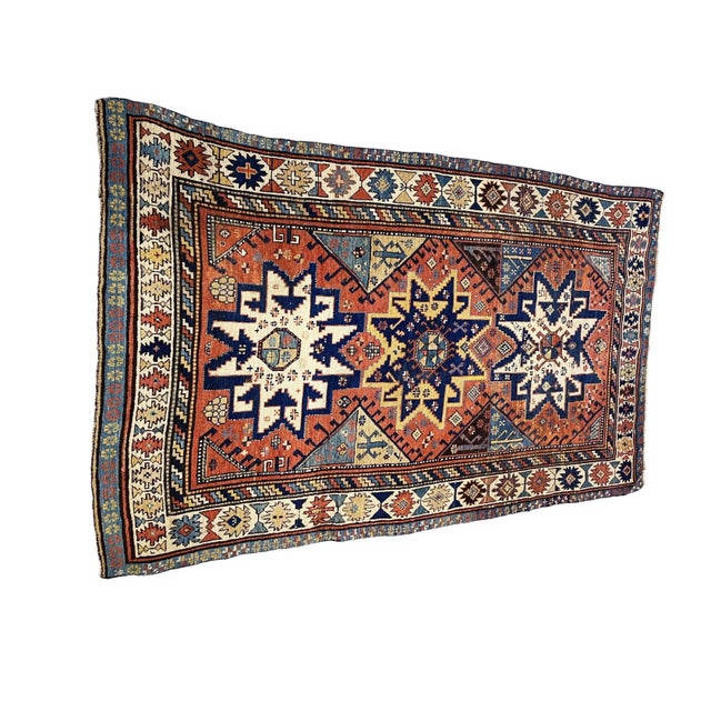 This 19th century tribal Star Kazak rug is a superb and rare find. It features a stunning geometric design with lovely...