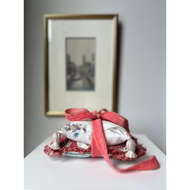 A collection of two decorative pillows filled with fragrant dried lavender, one small and the other large. Pretty enough...
