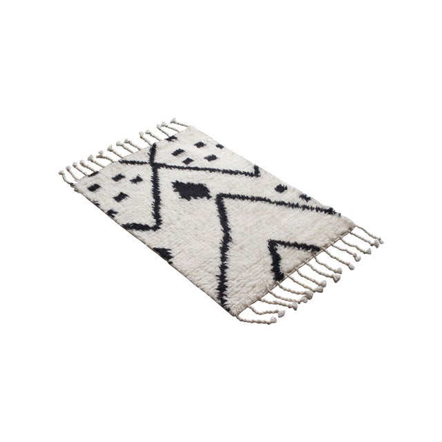 A refined 2x3 rug designed for versatile placement in intimate spaces. Ideal for entries, kitchens, baths, bedsides, and...