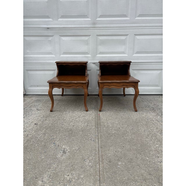 We have an absolutely gorgeous pair of vintage French Provincial step tables for sale. They offer both elegance and...
