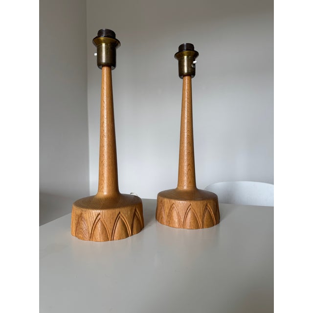 Pair oak table lamps by AB Stilarmatur Tranås Sweden, 1960s, very good condition. Sold with matching new linen lamp...