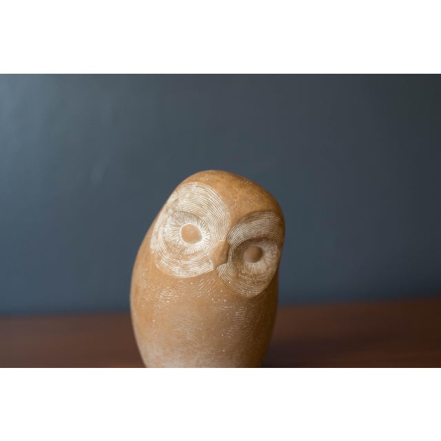 Vintage heavy cast stone owl sculpture by artist Islay Grimes, circa 1970's. This playful weighted art piece features...