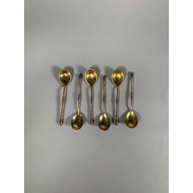 Set of 6 Russian silver and enamel spoons, 19th century. Silver spoons bearing the 84 zolotnik hallmark. Polychrome enamel...