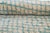 A fine mesh of blue, woven like morning mist. A delicate crosshatch of diamond lattice lines ripples across this piece in...