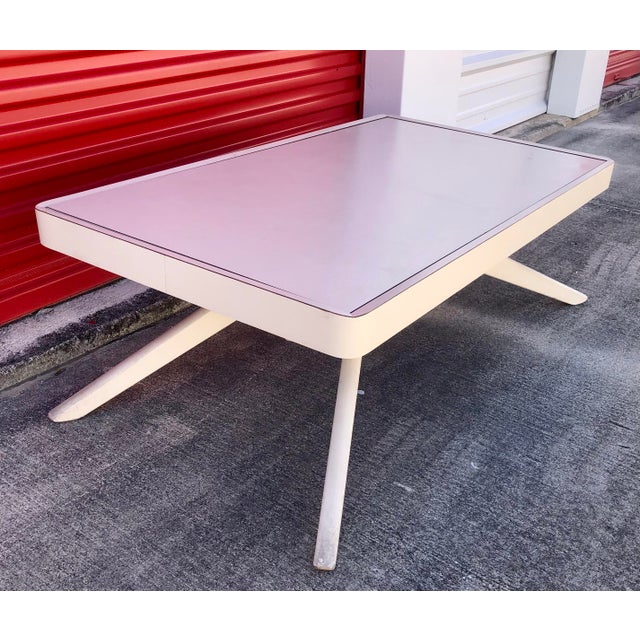 Wonderful mid century Castro Convertible white Formica coffee and dining table. Circa 1960s. Made in the USA. Converts...