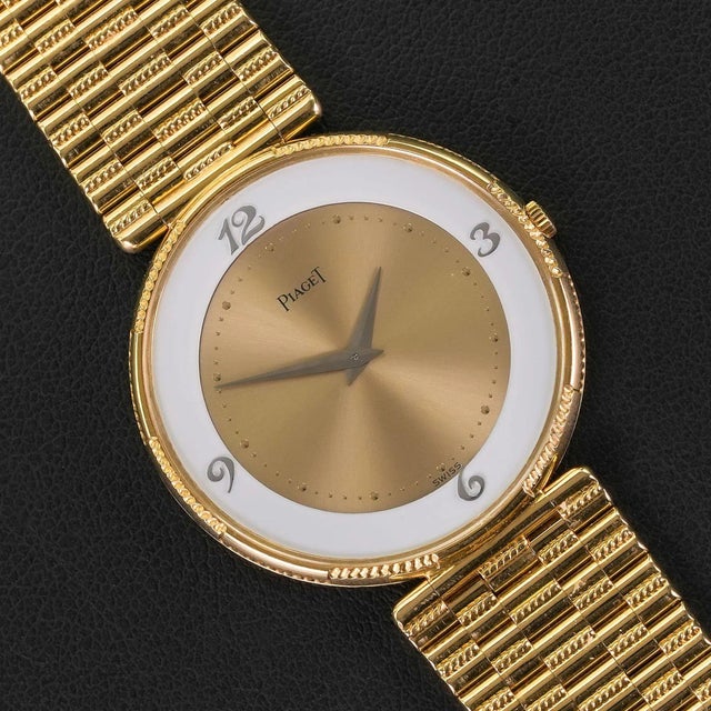 Piaget ref. 2642 G2 ladies ultra-thin manual wind wristwatch in 18K yellow gold featuring a champagne sunburst center dial...