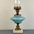 Vintage oil lamp with a gorgeous blue swirl glass font, brass accents and a marble base. Electrified with new wiring and...