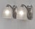 Hettier & Vincent A pair of French art deco wall sconces in nickel plated bronze and clear frosted molded-pressed glass....