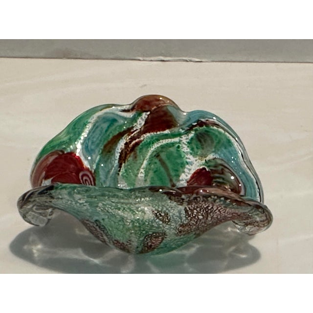 Cheerful and very colorful Murano attributed tutti fruitti art glass bowl . Free form design with silver foil flecks ,...