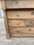 French 18th-century Empire-style bleached walnut commode, featuring a simple architectural form, three drawers, columnar...