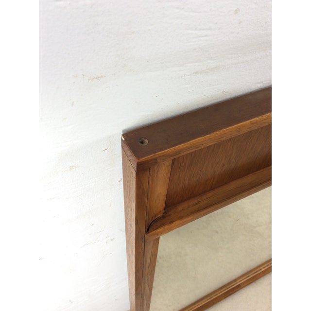 This mid century modern mirror features long rectangular frame, hard wood frame with walnut finish and a unique carved...