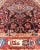 Measures: 4'3 x 9'4. This absolutely stunning Antique Nahavand (circa 1920s) features a symmetrical sub-geometric design...
