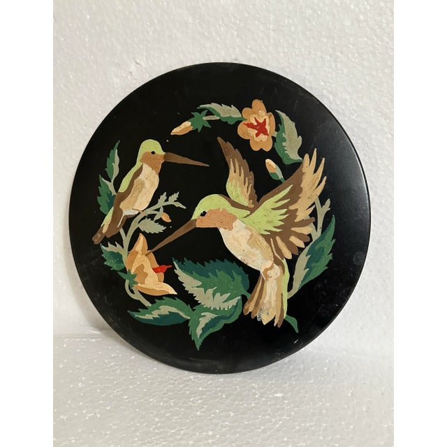 Set of 2 hand painted metal decorative accent plates from the 1960s/70s era. Each plate features a different bird pair in...