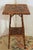 Circa 1880s 2-tier square bamboo side table, English. The surfaces now artisan decoupaged with shells. Decorative strut...