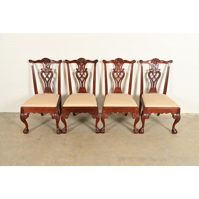 An outstanding set of four Chippendale or Georgian style dining chairs By Baker Furniture USA, Circa 1980s Carved solid...