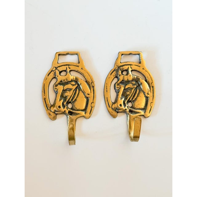 Charming vintage horse brass equestrian medal wall hooks, sold individually. These have the shape of the horse brasses...